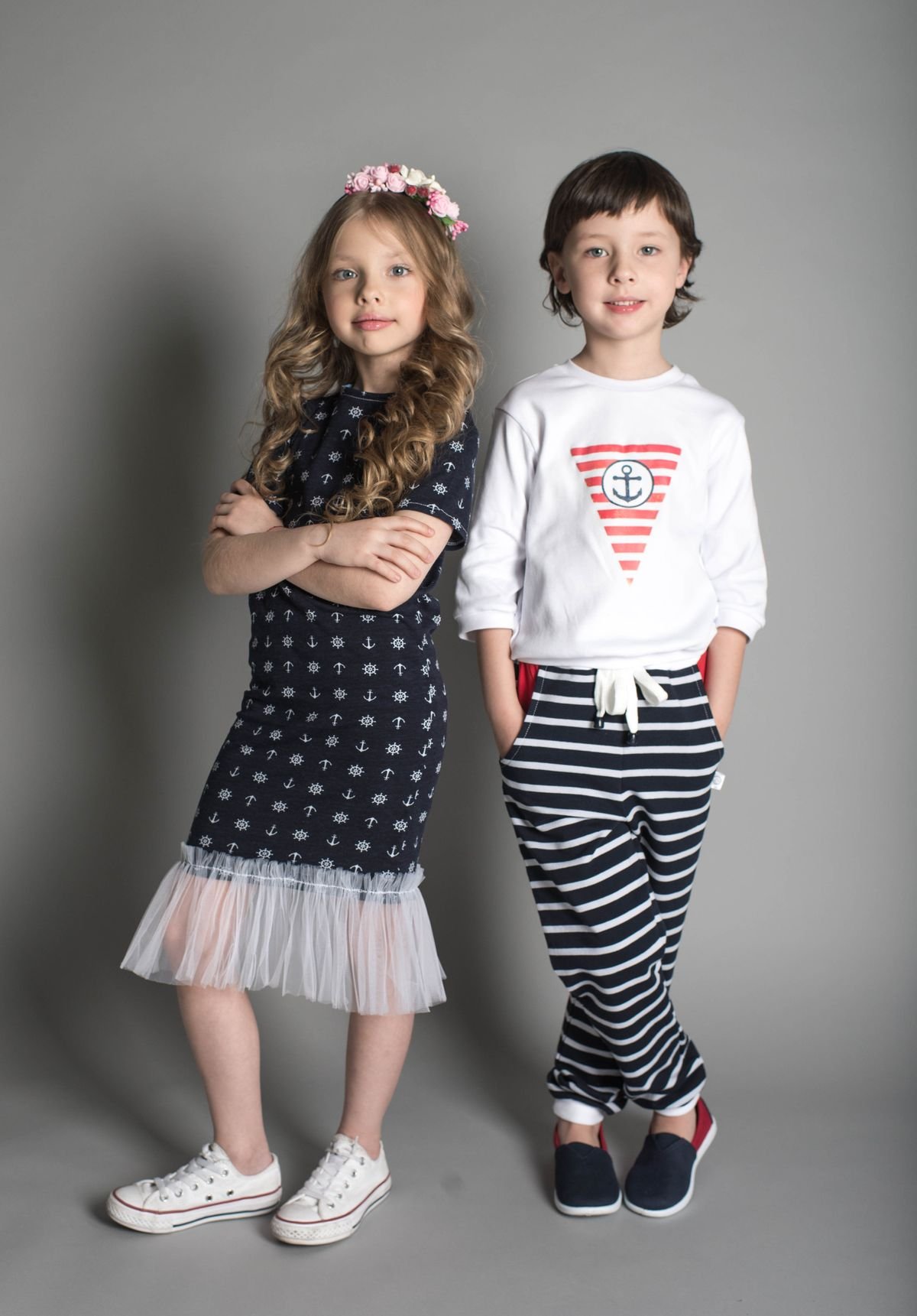 Two young children standing side by side
